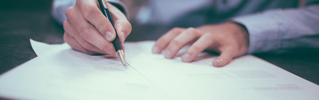 Hands working at desk