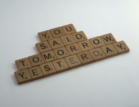 Scrabble pieces that read you said tomorrow yesterday